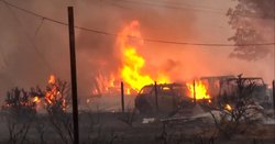 Wildfire burns out of control in Reno as thousands evacuate